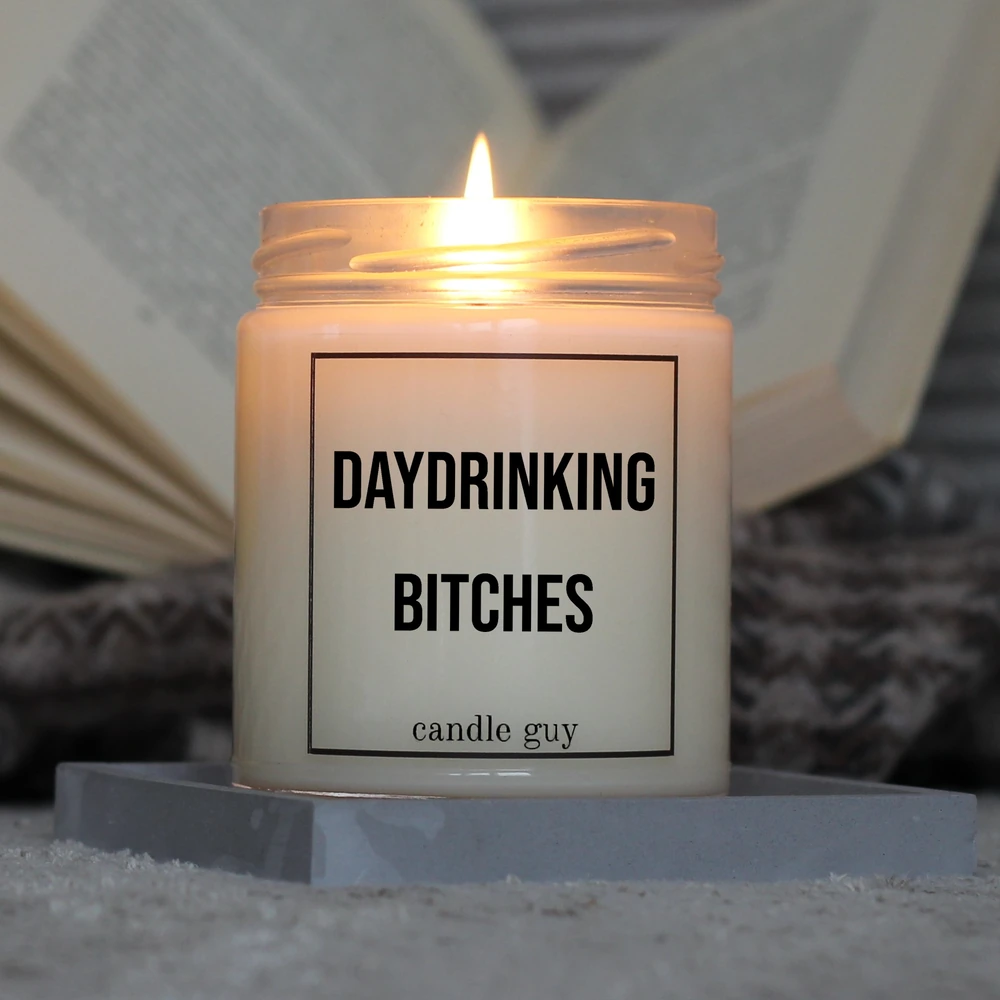 Candle Guy scented candle with the slogan "Daydrinking Bitches" in action – burns for over 70 hours