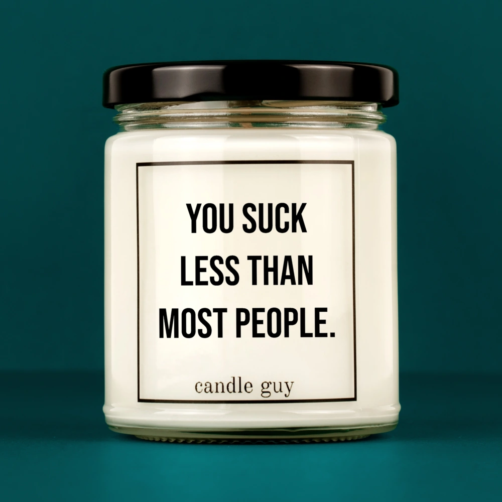 Kerze mit Spruch | You suck less than most people. | Farbe Weiß